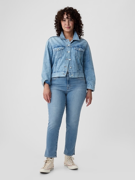 vintage slim jeans mit mittelhohem bund und schlitz-hem