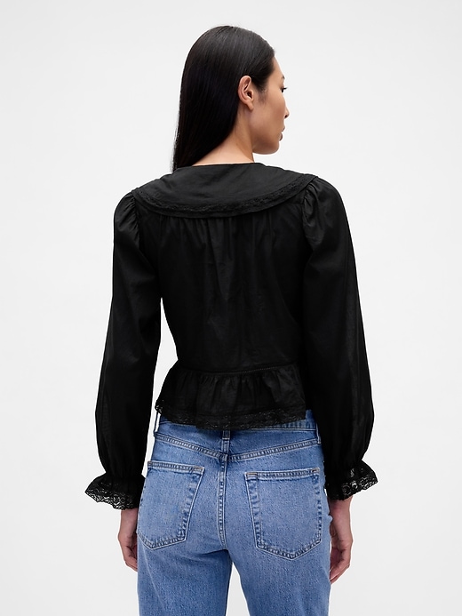 peplum-top mit kragen und v-ausschnitt