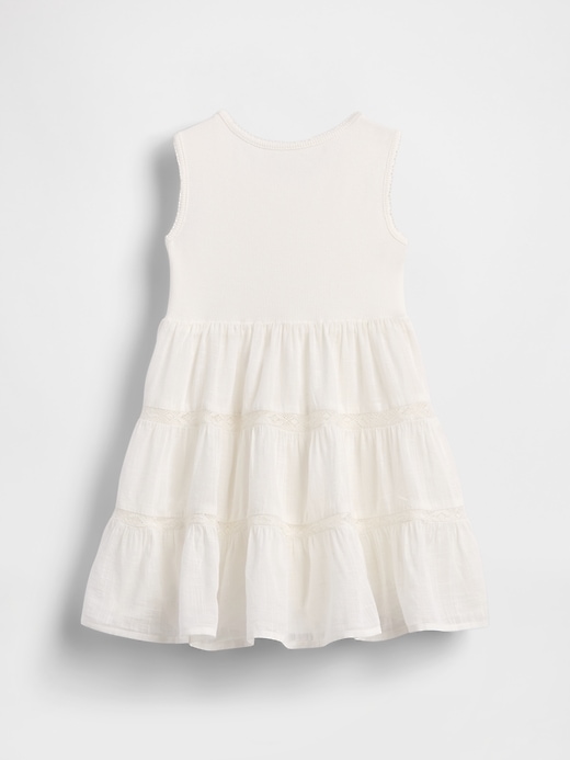 kleid aus spitzenbesatz und verschiedenen materialien für babys und kleinkinder